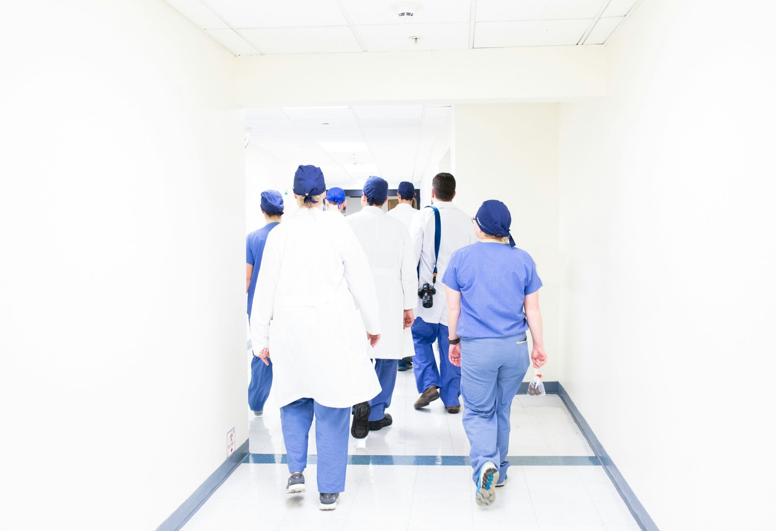 health care logistics group of doctors walking on hospital hallway